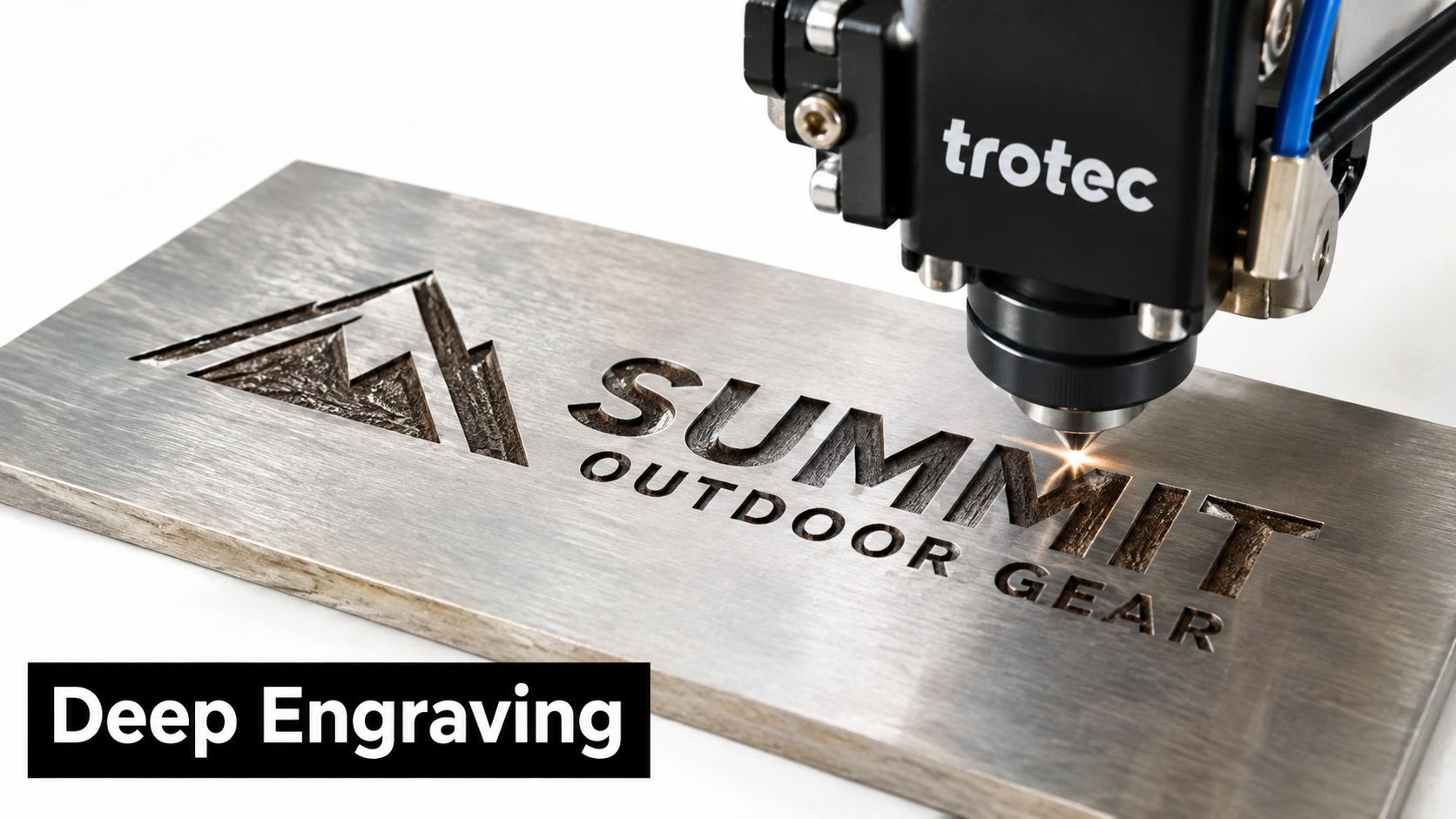 A Trotec laser machine performing deep engraving on a metal plate featuring a summit outdoor gear logo.