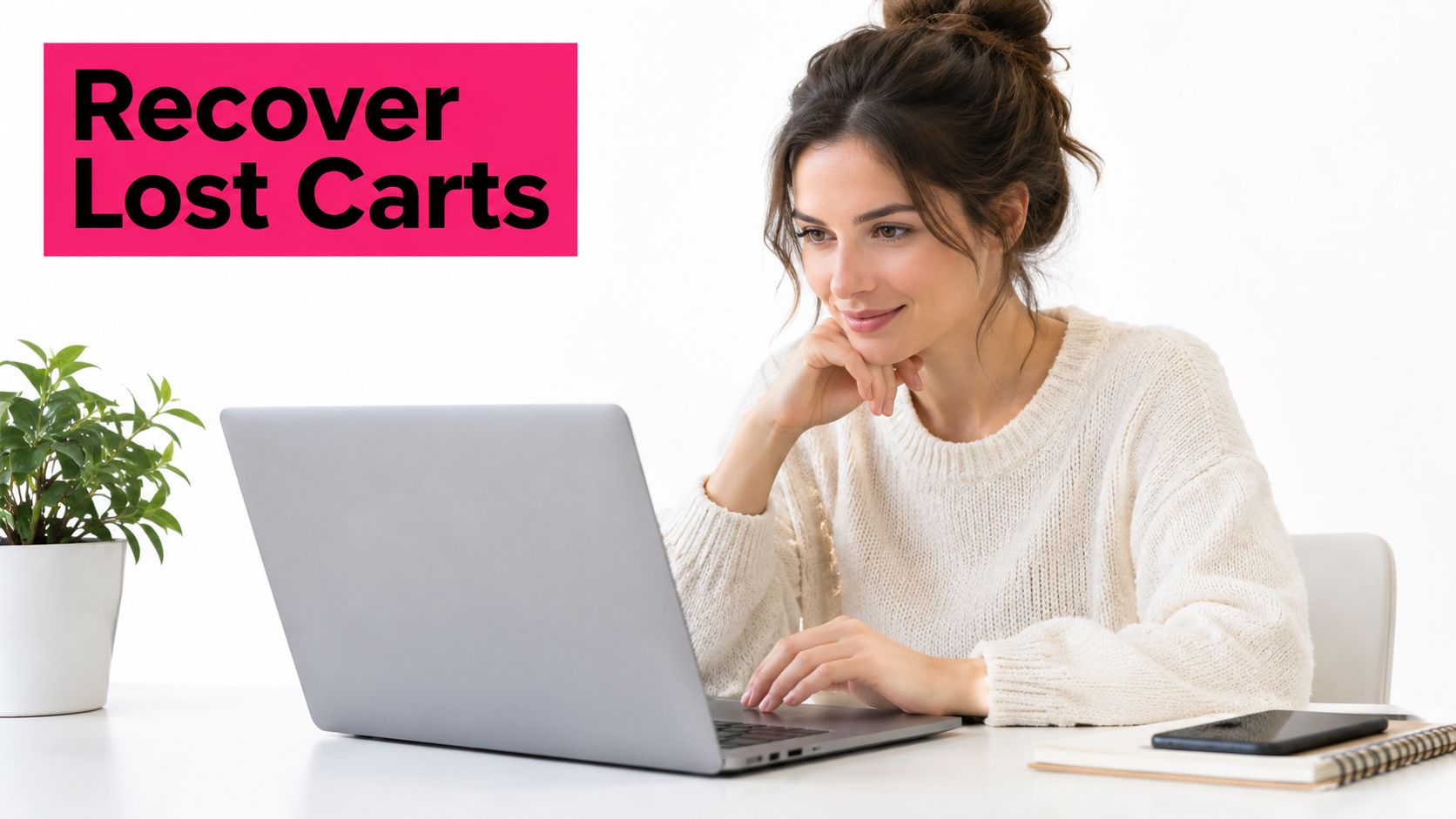 A woman using a laptop with a pink Recover Lost Carts sign in the background.