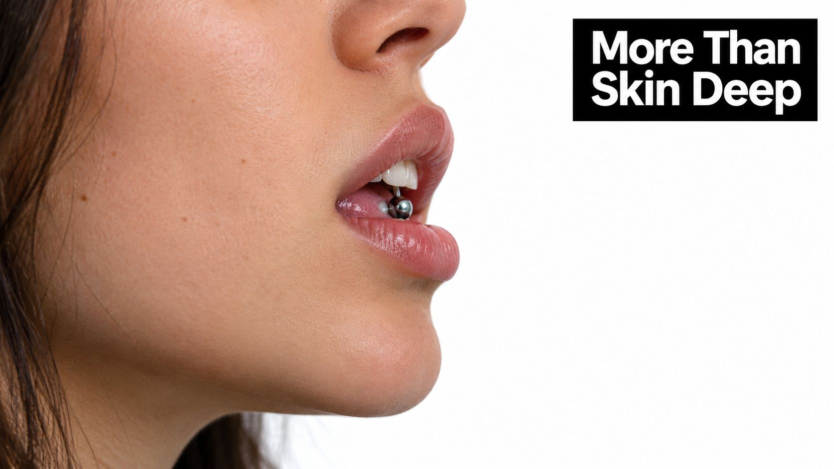 A close-up profile view of a person wearing a metallic labret lip piercing on their bottom lip.