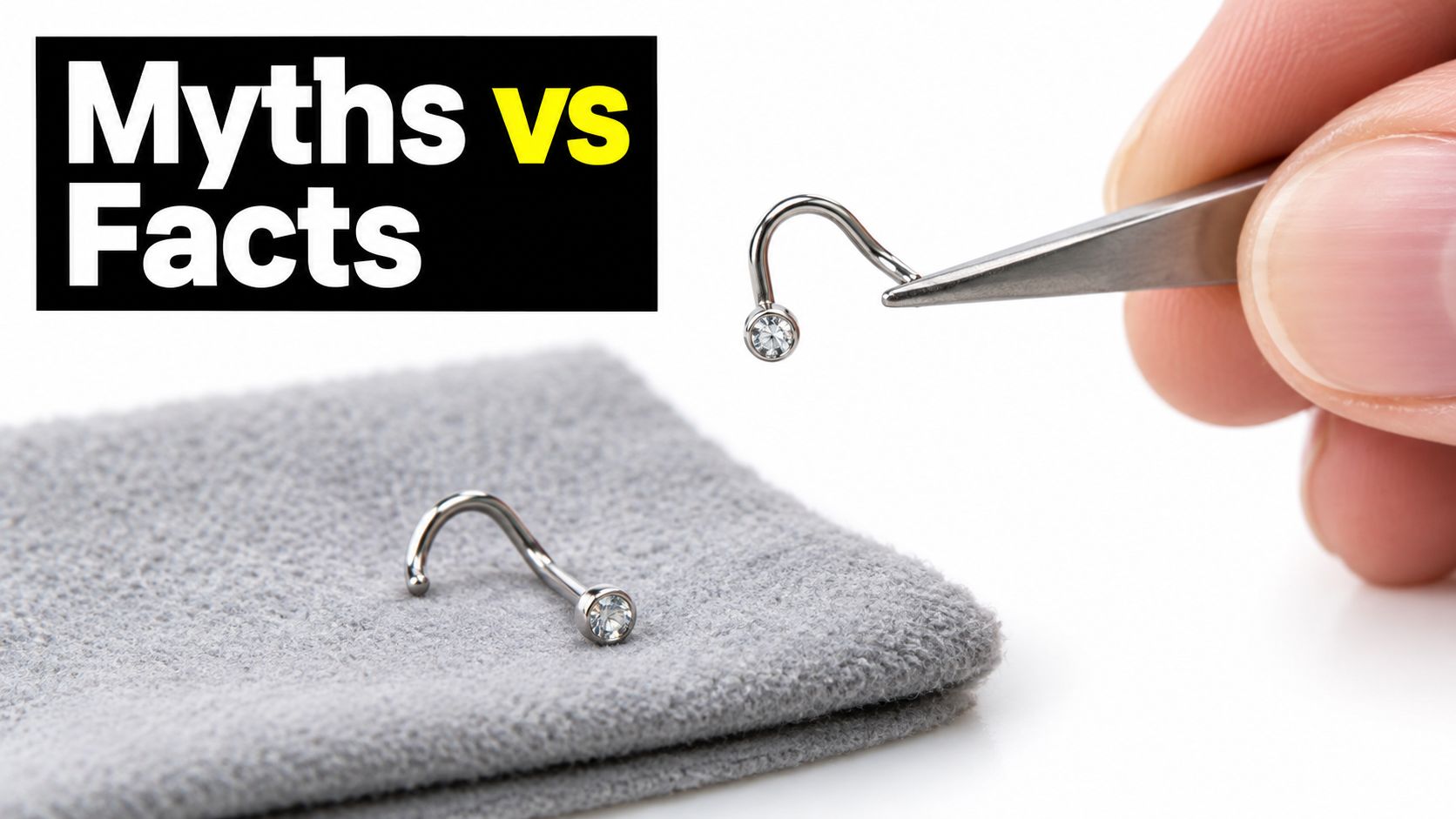 A pair of titanium nose screws being handled with tweezers next to a grey jewelry cleaning cloth.