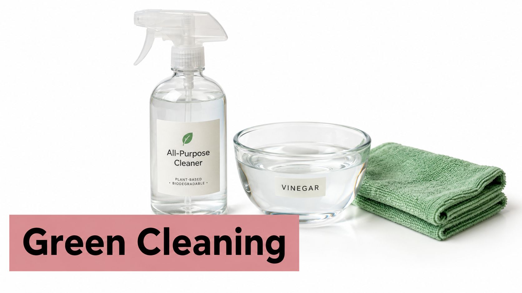 A clear spray bottle, a glass bowl of vinegar, and a folded green microfiber cloth on white.