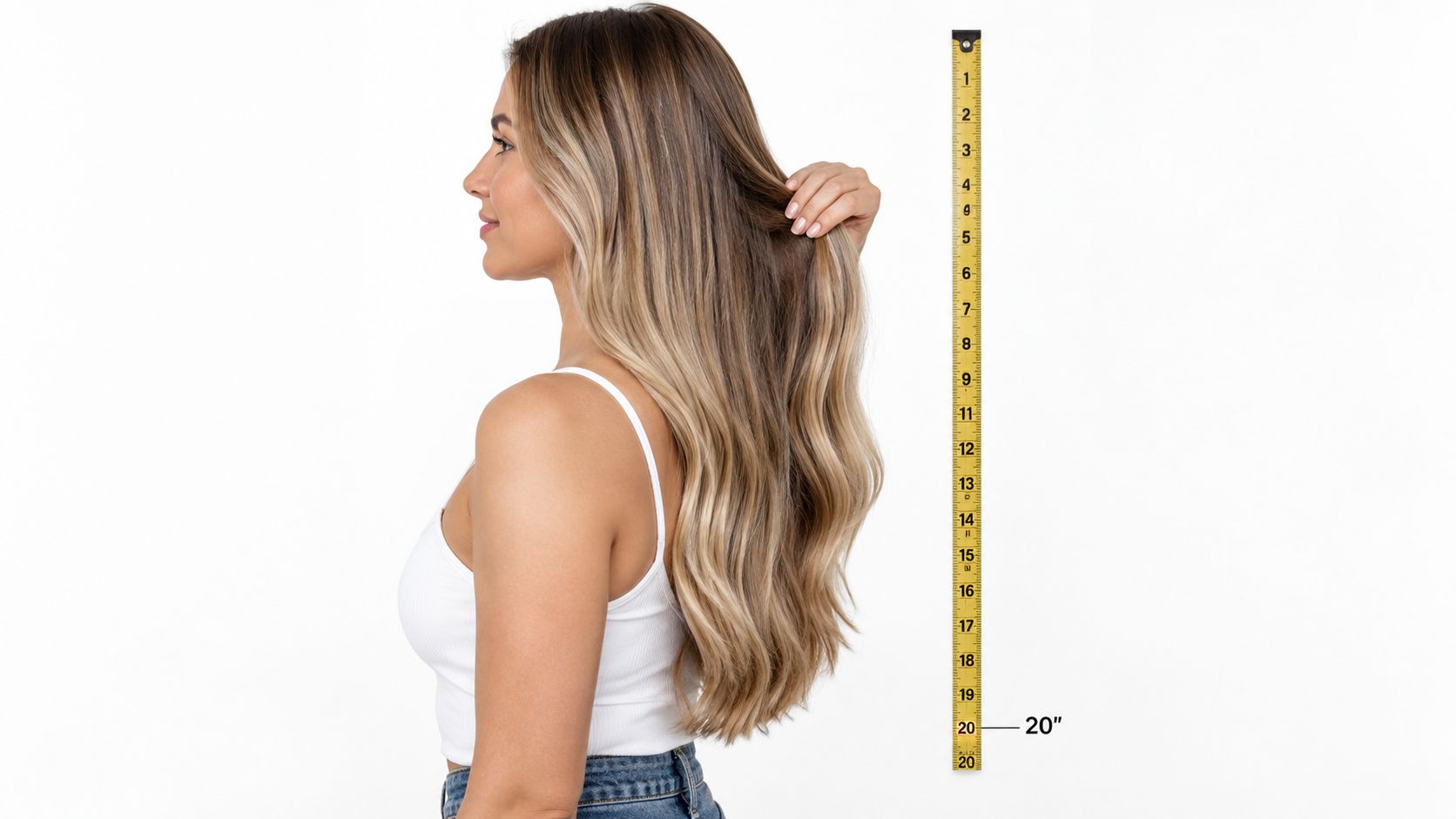 A woman demonstrating the length of 20-inch hair extensions using a vertical measuring tape against a white background.