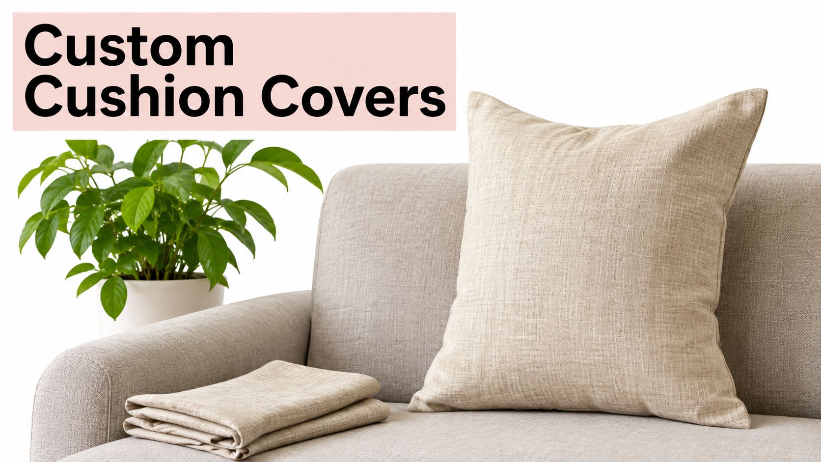 A beige textured square throw pillow and folded fabric placed on a light gray sofa with a plant.