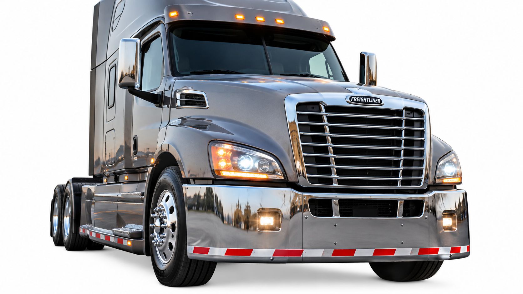A modern grey Freightliner semi-truck parked against a white background, featuring a polished chrome bumper.