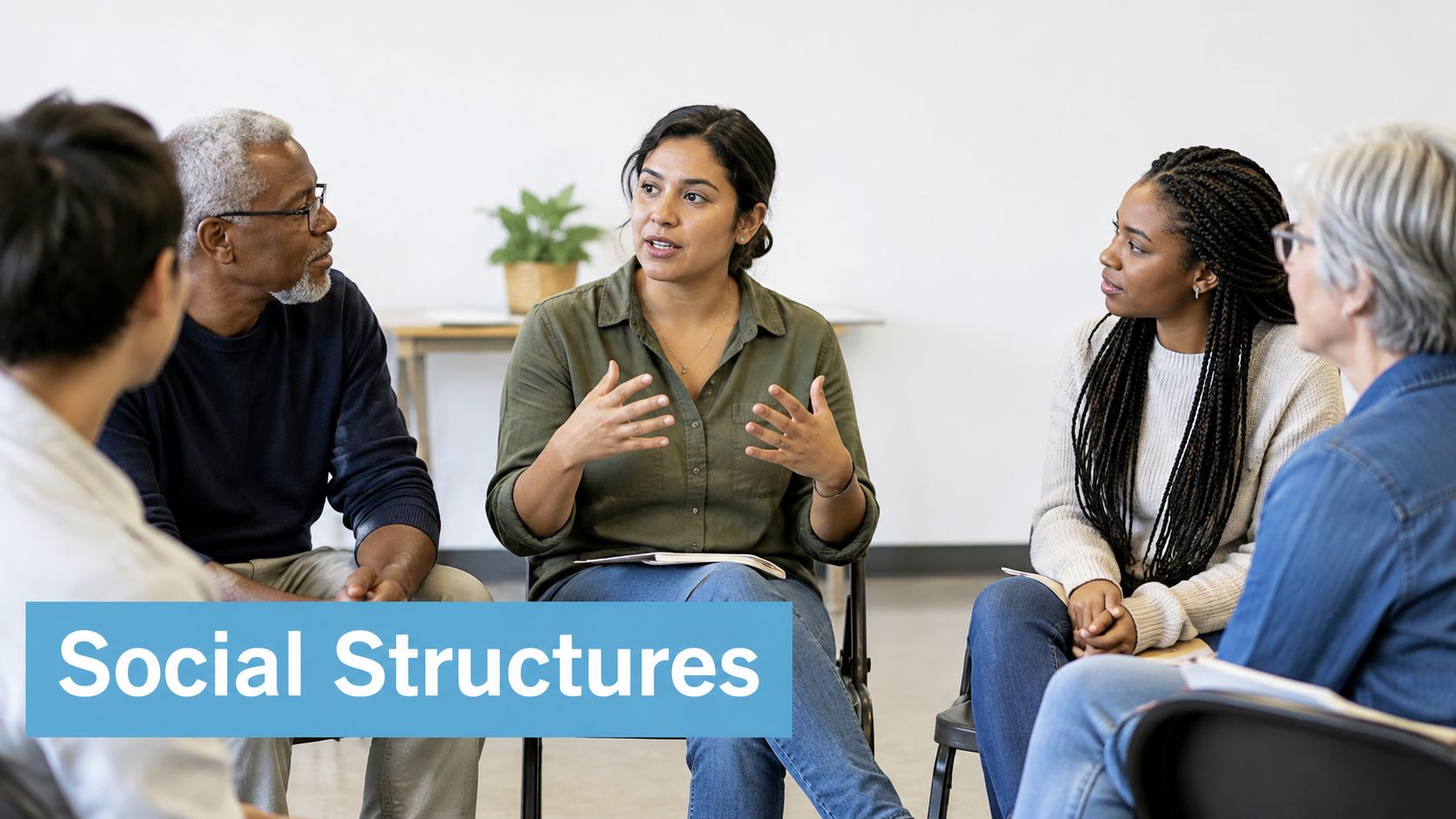 A diverse group of adults sitting in a circle, engaged in a discussion during a meeting.