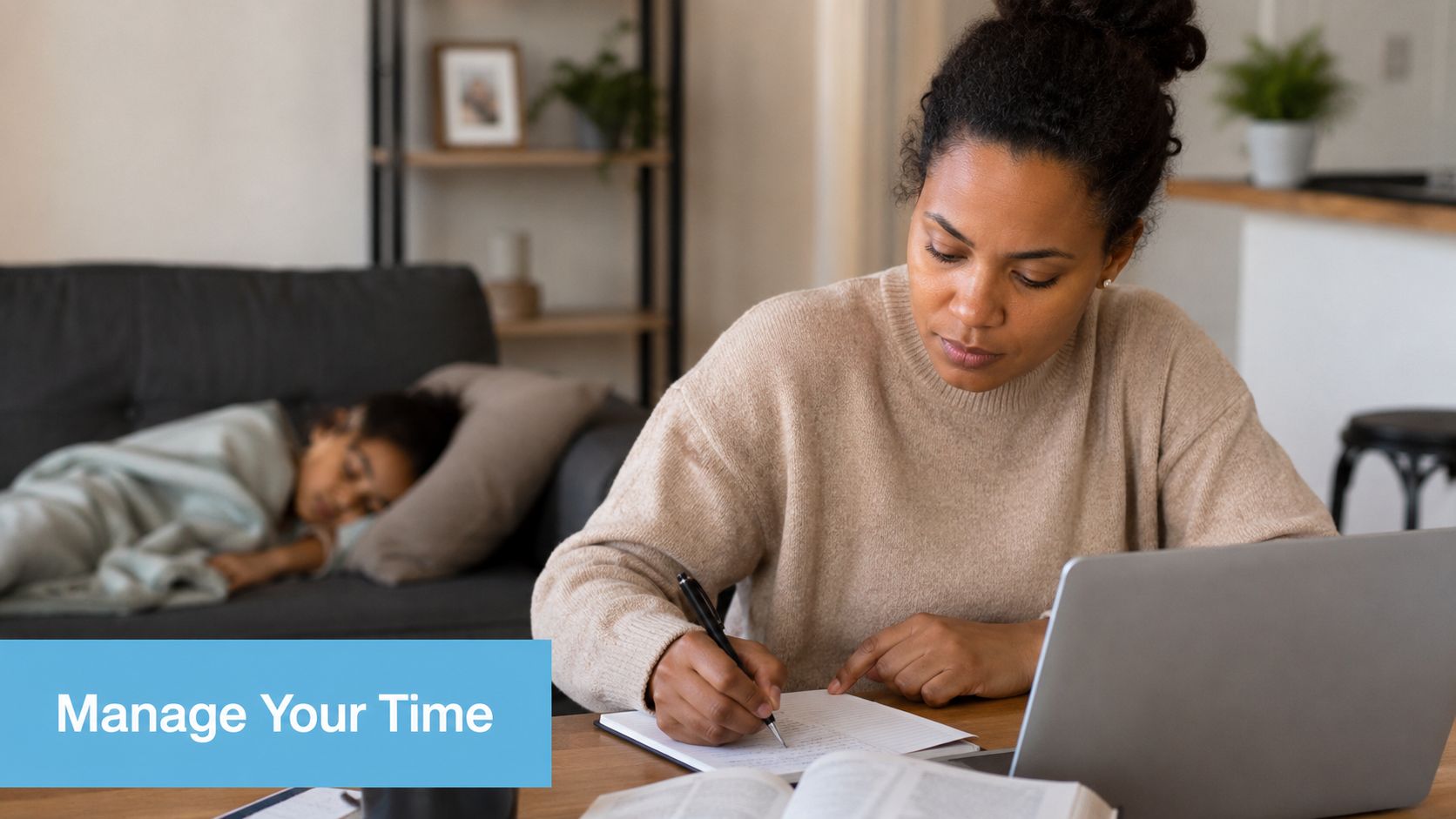 A woman working on a laptop and taking notes while a child sleeps on the couch.