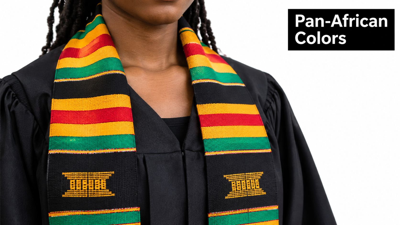 A person wearing a black graduation gown with a traditional colorful Pan-African stole featuring geometric patterns.