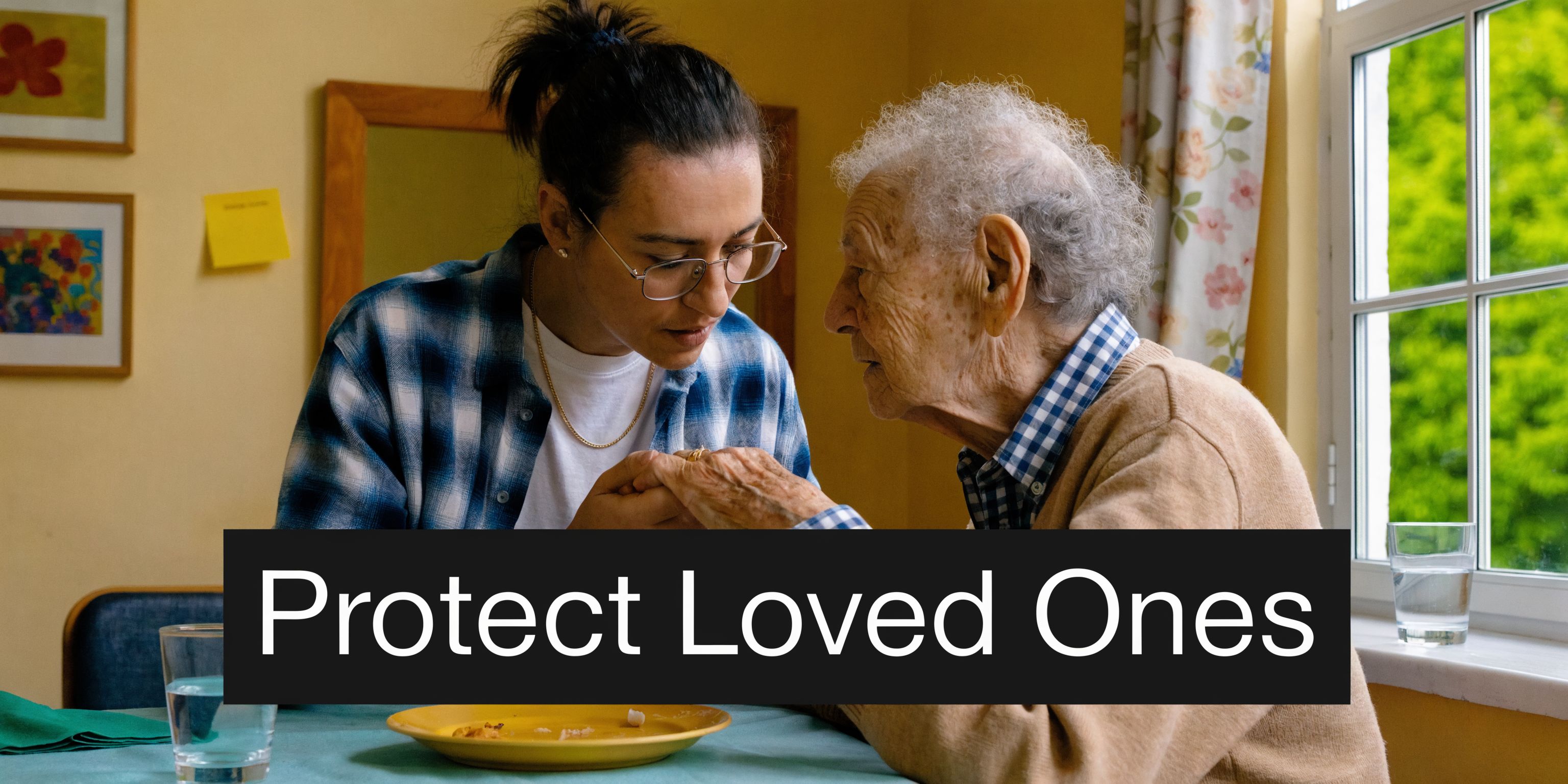 A person holding the hands of an elderly individual at a table in a nursing home setting.