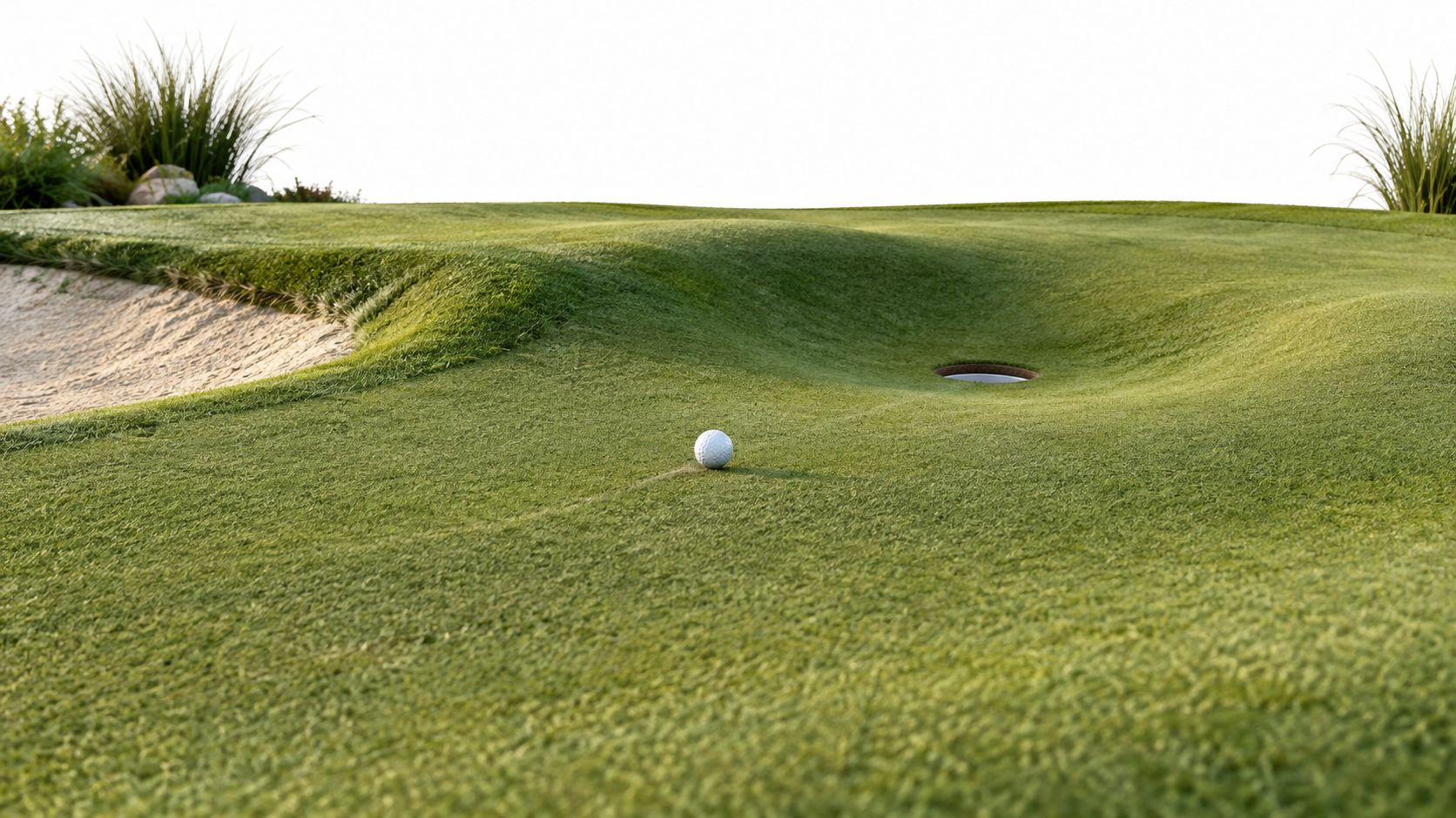 A white golf ball sitting on a lush green putting surface near a golf hole and bunker.