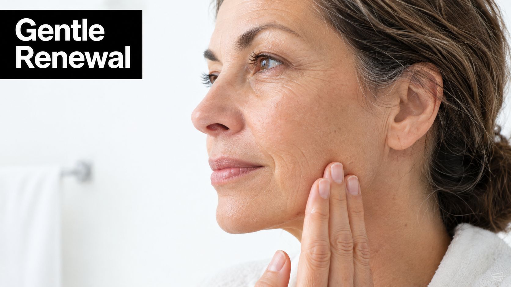A mature woman gently touches her face, highlighting skin care and gentle renewal for aging skin.