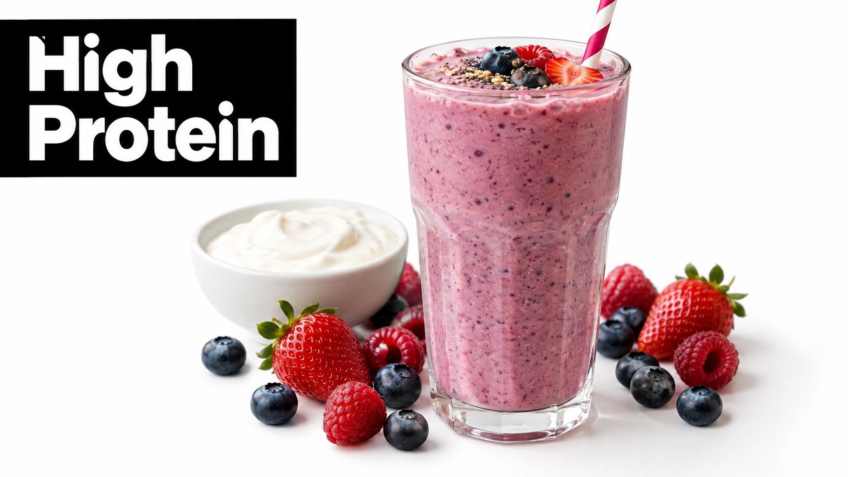 A healthy berry smoothie in a tall glass next to a bowl of Greek yogurt and fresh fruit.