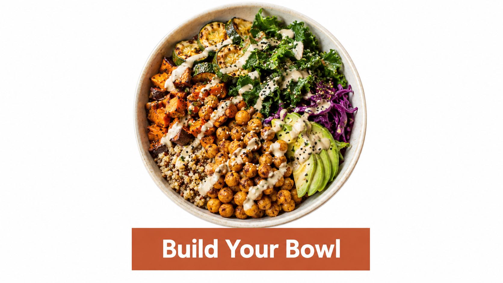 A healthy vegan Buddha bowl featuring roasted chickpeas, quinoa, sweet potatoes, kale, avocado, and drizzled tahini dressing.
