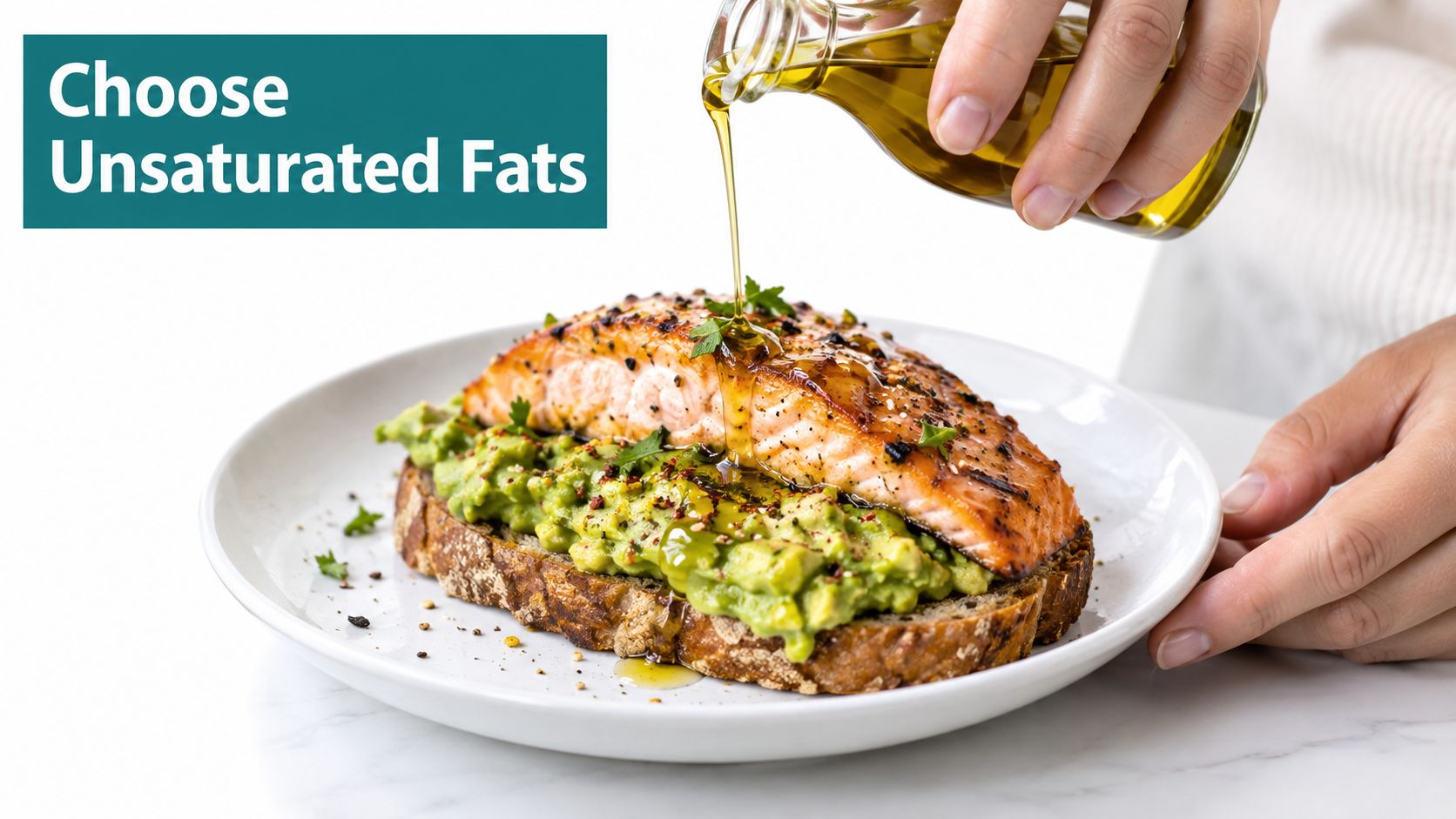 A grilled salmon fillet served on avocado toast being drizzled with healthy olive oil for heart health.