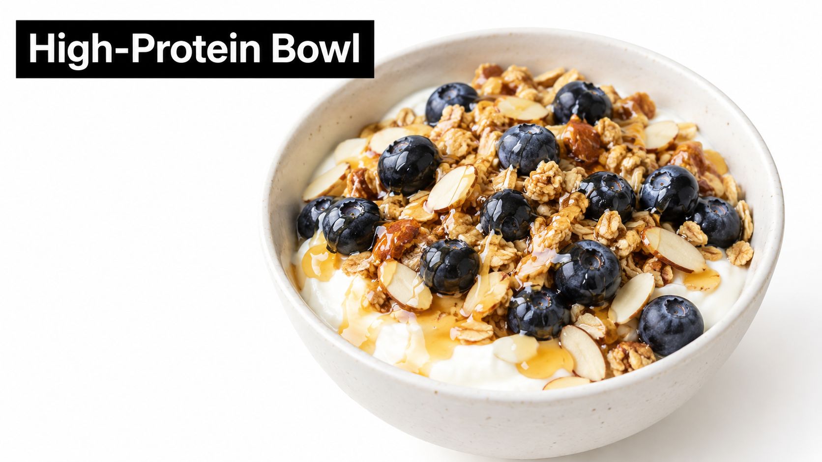 A ceramic bowl filled with creamy yogurt, topped with crunchy granola, fresh blueberries, and sliced almonds.