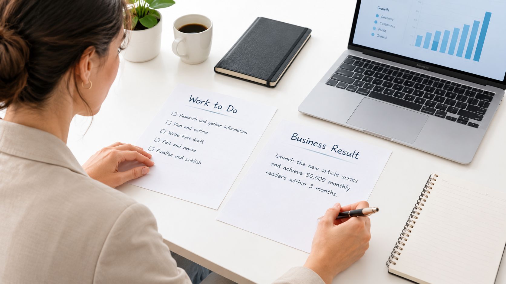 A businesswoman planning her professional goals by writing on papers at a neat, organized office workspace.