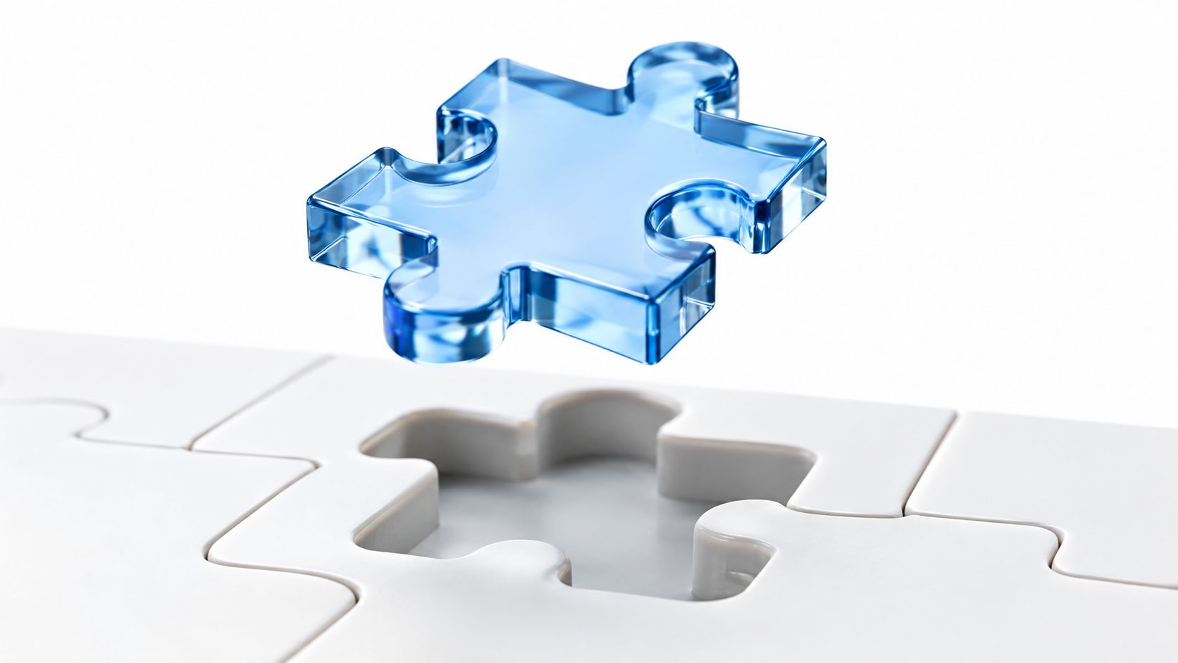 A glossy blue glass puzzle piece hovering above an empty space in a white puzzle board.