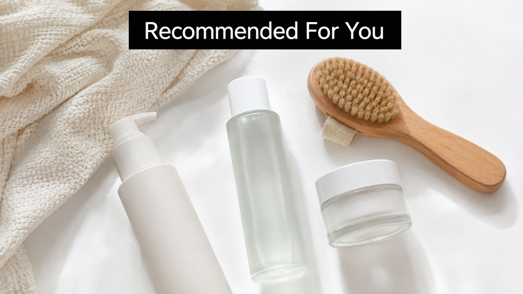 A flat lay of skincare products, including a lotion bottle, serum, and a wooden bath brush