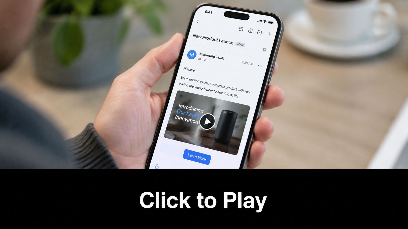 A person holding a smartphone displaying an email containing an embedded product video for a marketing campaign.
