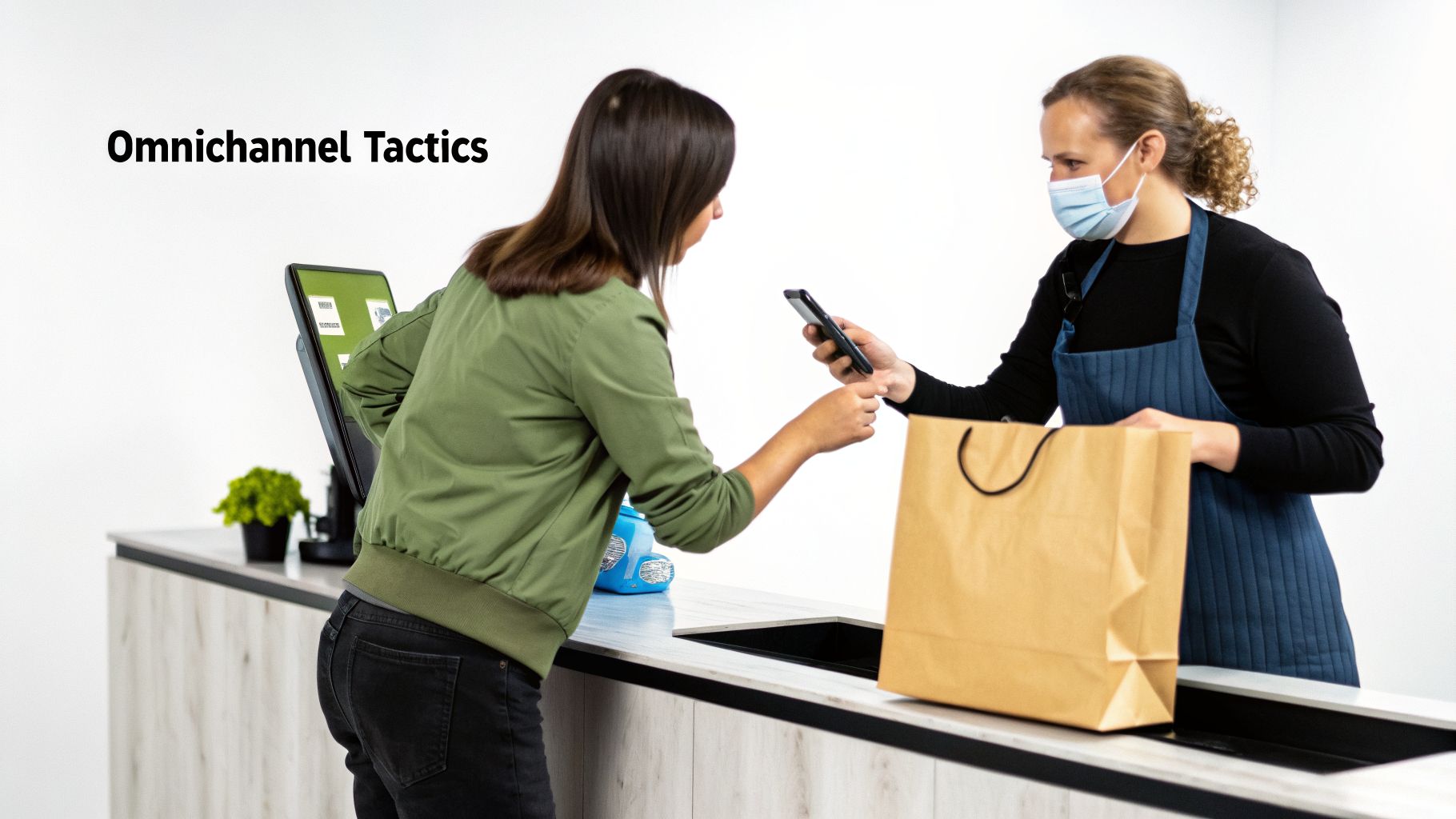 Customer uses smartphone for mobile payment at a modern retail counter, assisted by a sales associate.