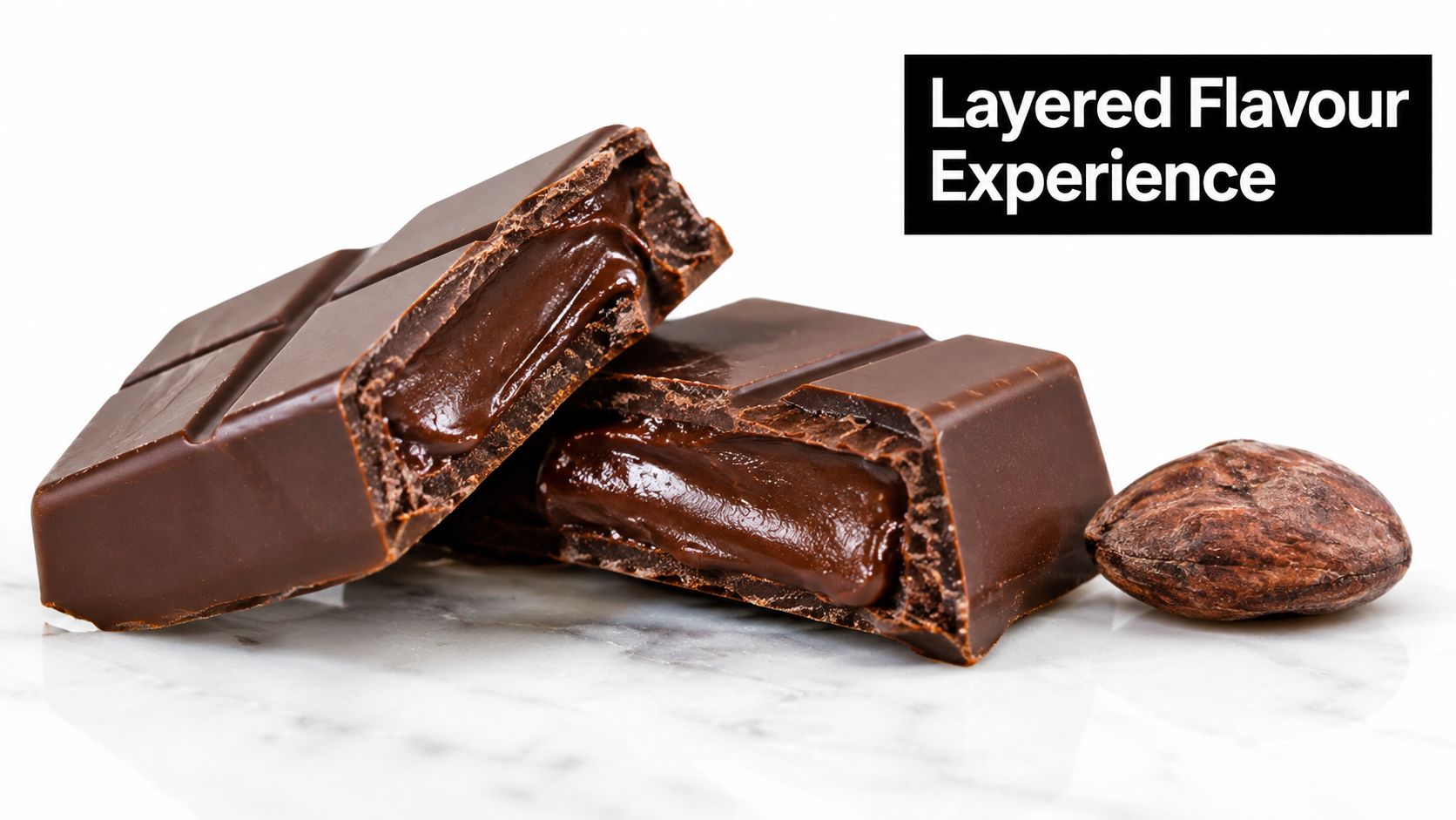 A close-up of two pieces of rich filled dark chocolate bars with a cacao bean on marble