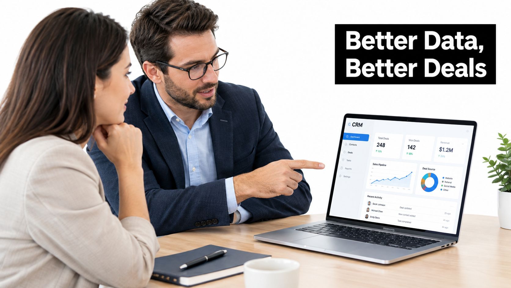 A professional man and woman discussing sales data on a laptop in a modern office setting.