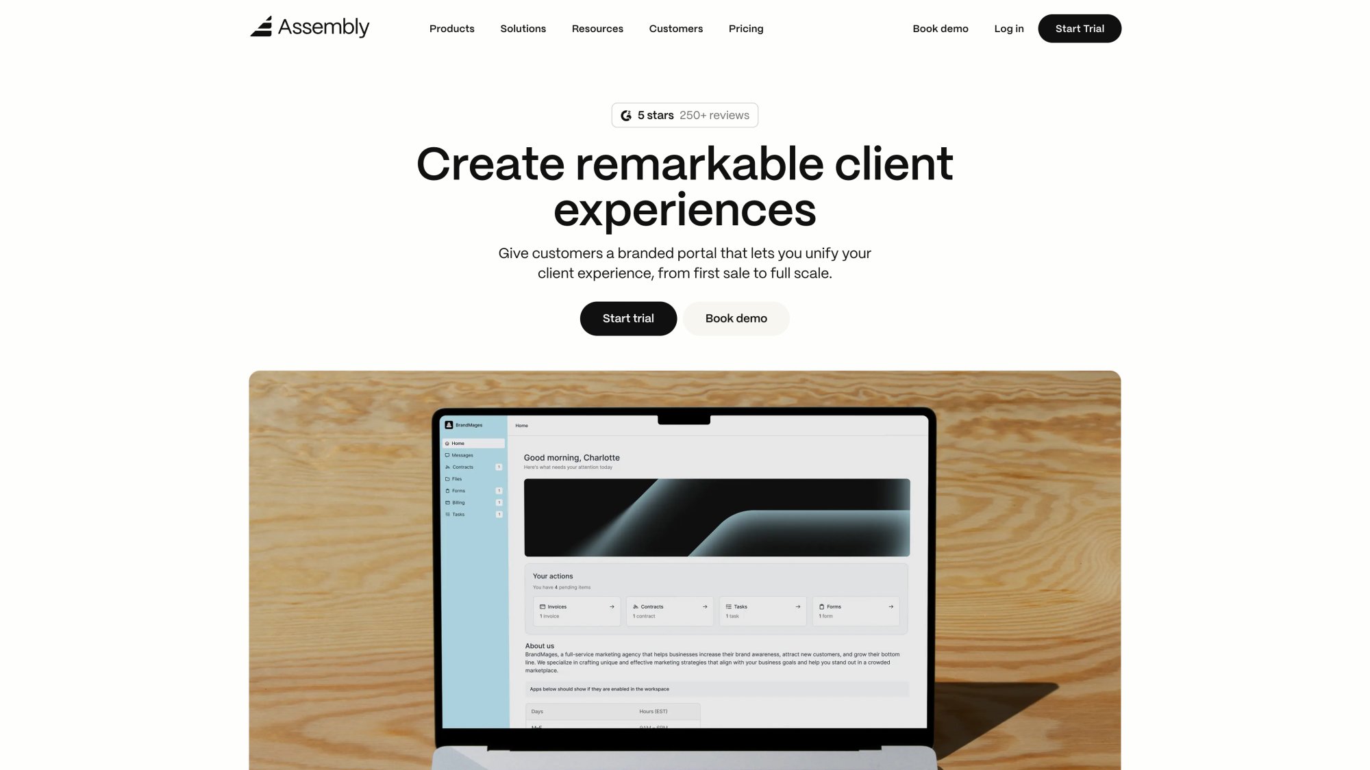 Assembly client portal homepage with Create remarkable client experiences hero headline and branded dashboard preview