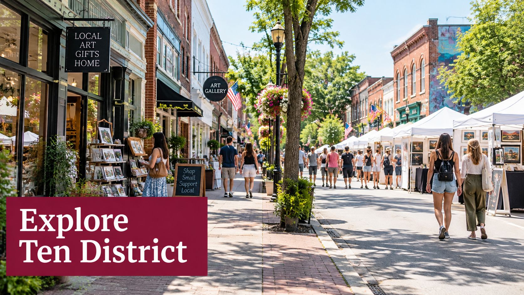People walking along a charming downtown street lined with art galleries, shops, and outdoor festival vendor tents.