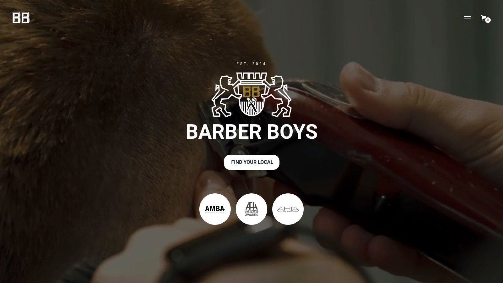 A barber at Barber Boys giving a client a sharp haircut.