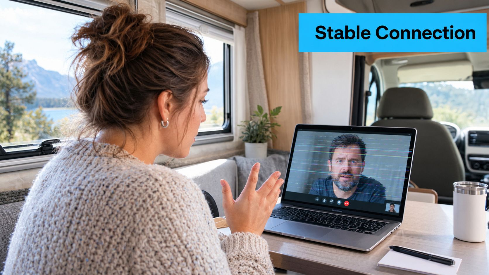 A woman participates in a video call inside a camper van, experiencing connection issues on her laptop.