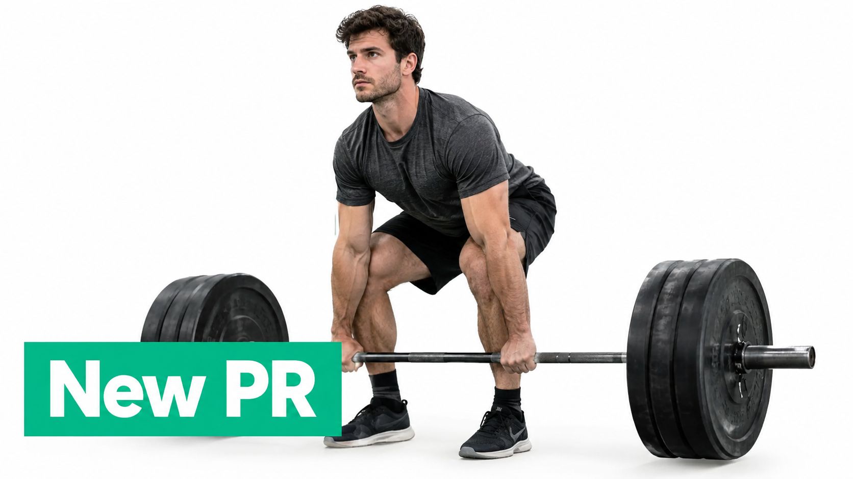 A fit man preparing to lift a heavy barbell with weight plates during a strength training session.
