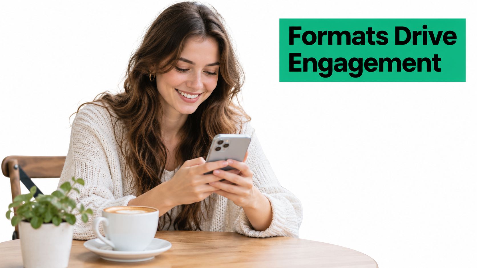 A smiling young woman sits at a cafe table using her smartphone next to a coffee cup.
