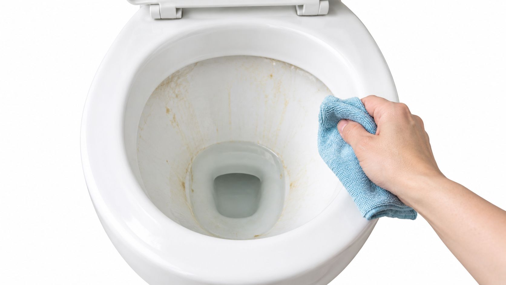 A hand wearing a blue microfiber cloth is cleaning the inside of a dirty white toilet bowl.