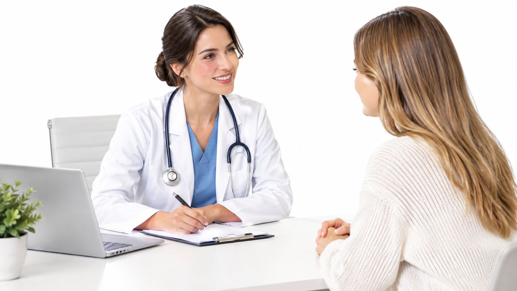 A friendly female doctor smiles while consulting with a patient in a medical office setting.