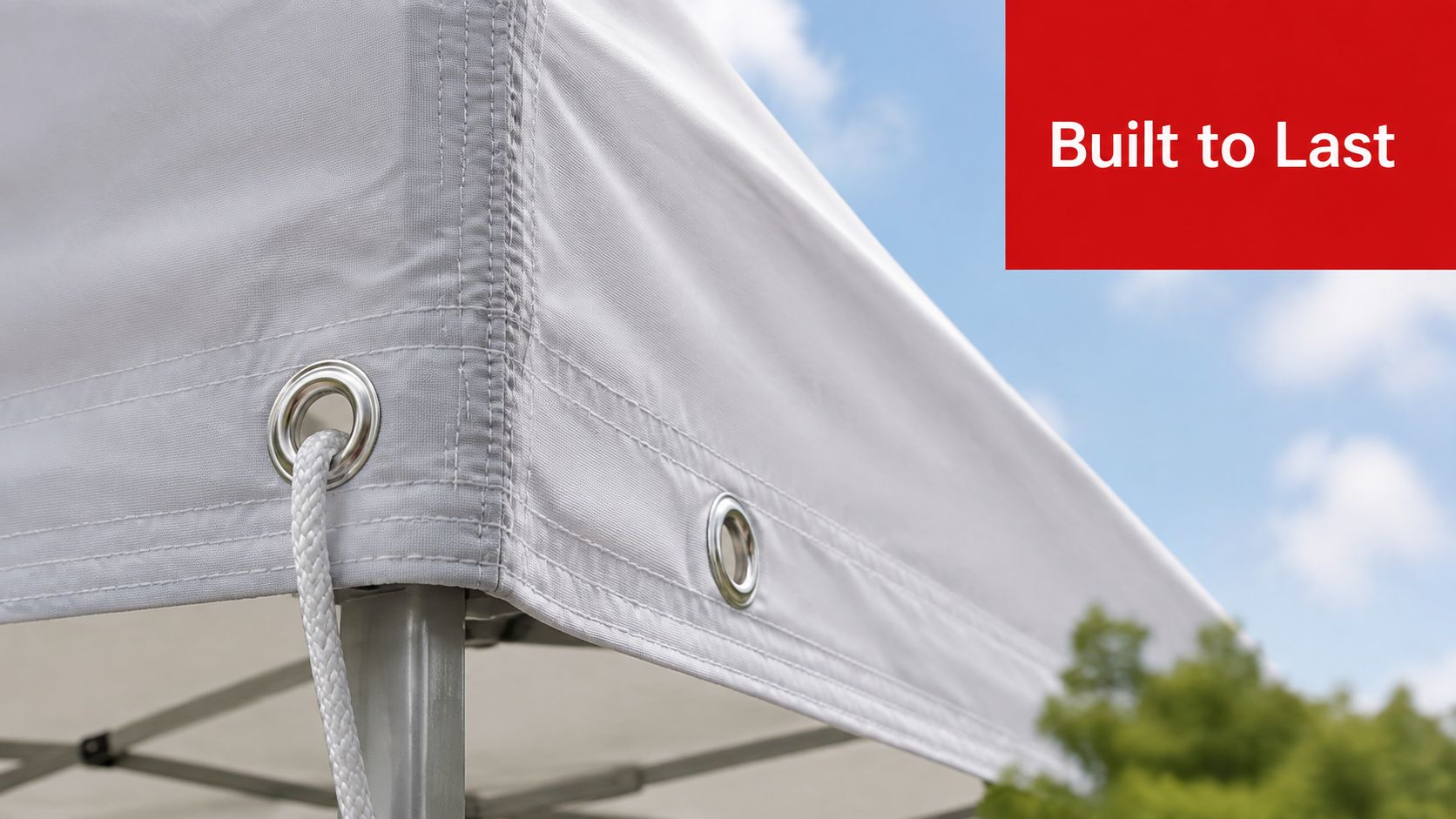 A close-up shot showing the reinforced corner and grommet detail of a durable white canopy tent.
