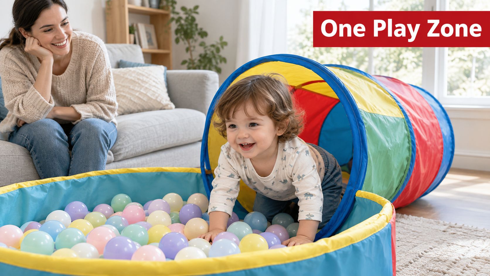 A happy toddler crawling through a colorful play tunnel into a ball pit while mother watches smiling.