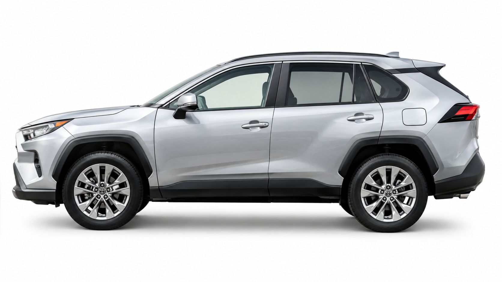 A side profile view of a silver Toyota RAV4 compact SUV parked against a plain white background.