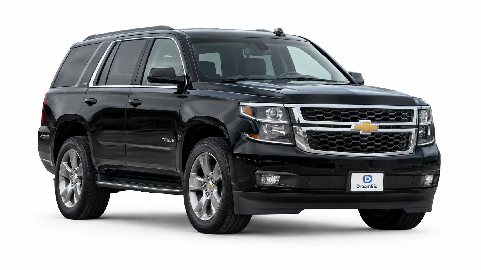A glossy black Chevrolet Tahoe SUV parked on a white studio background, showcasing its full exterior design.