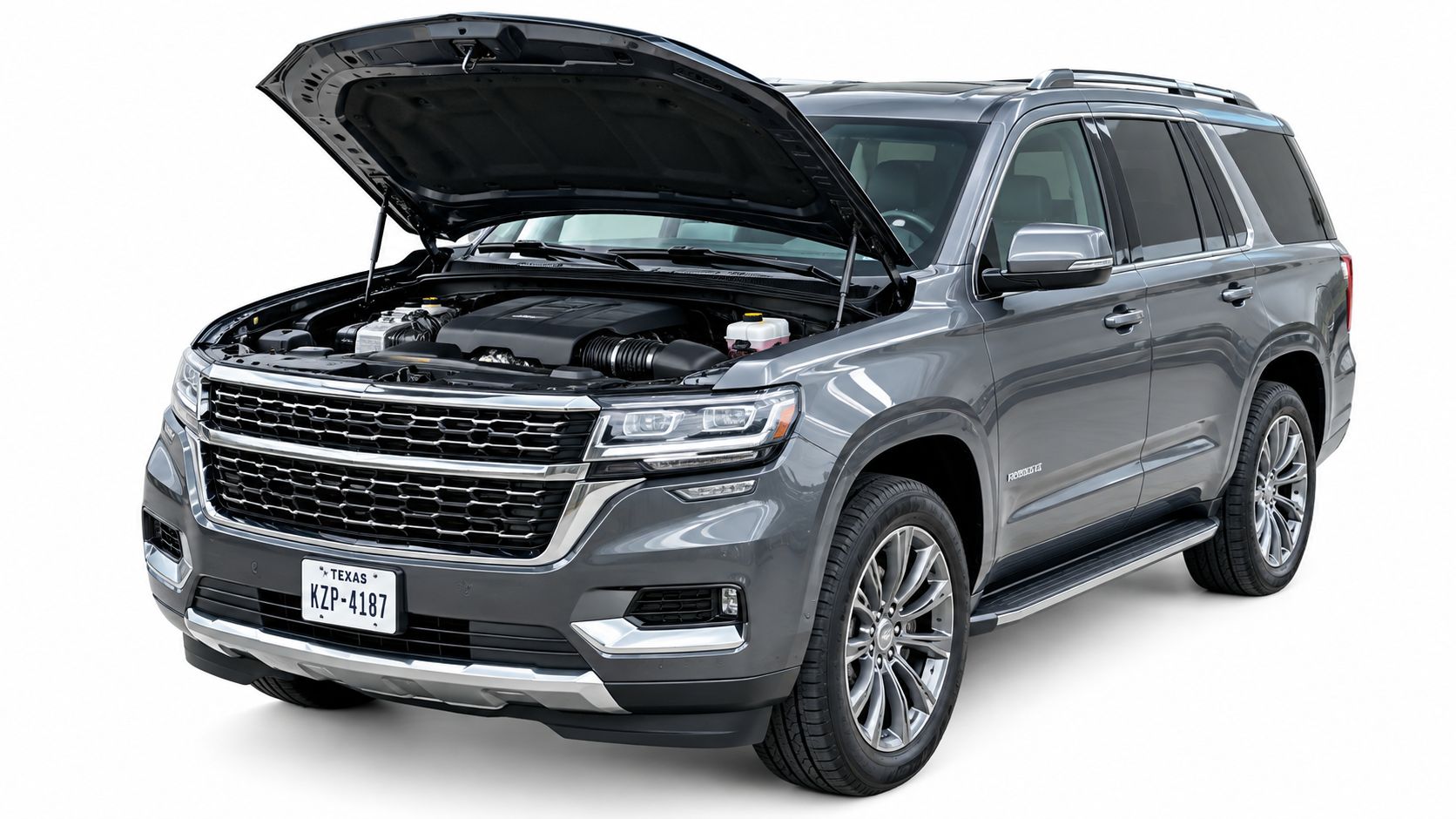 A modern grey SUV parked with its hood open, showcasing its engine against a plain white background.