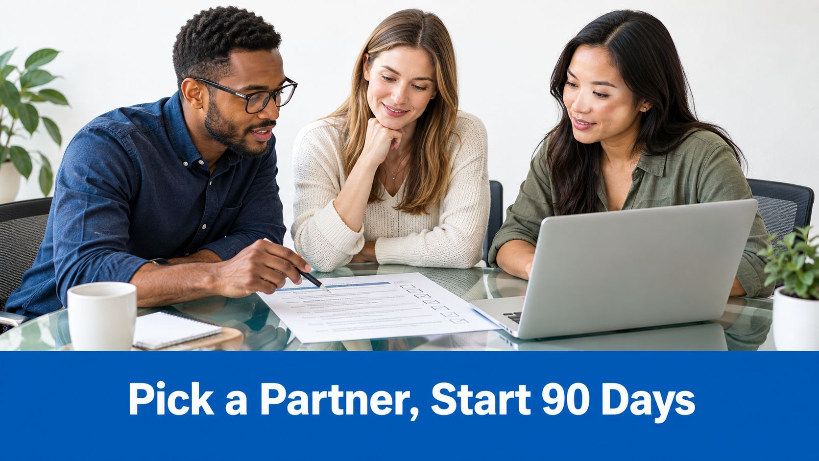 Three professionals collaborating around a laptop and paper document to discuss business partnership and growth strategies.