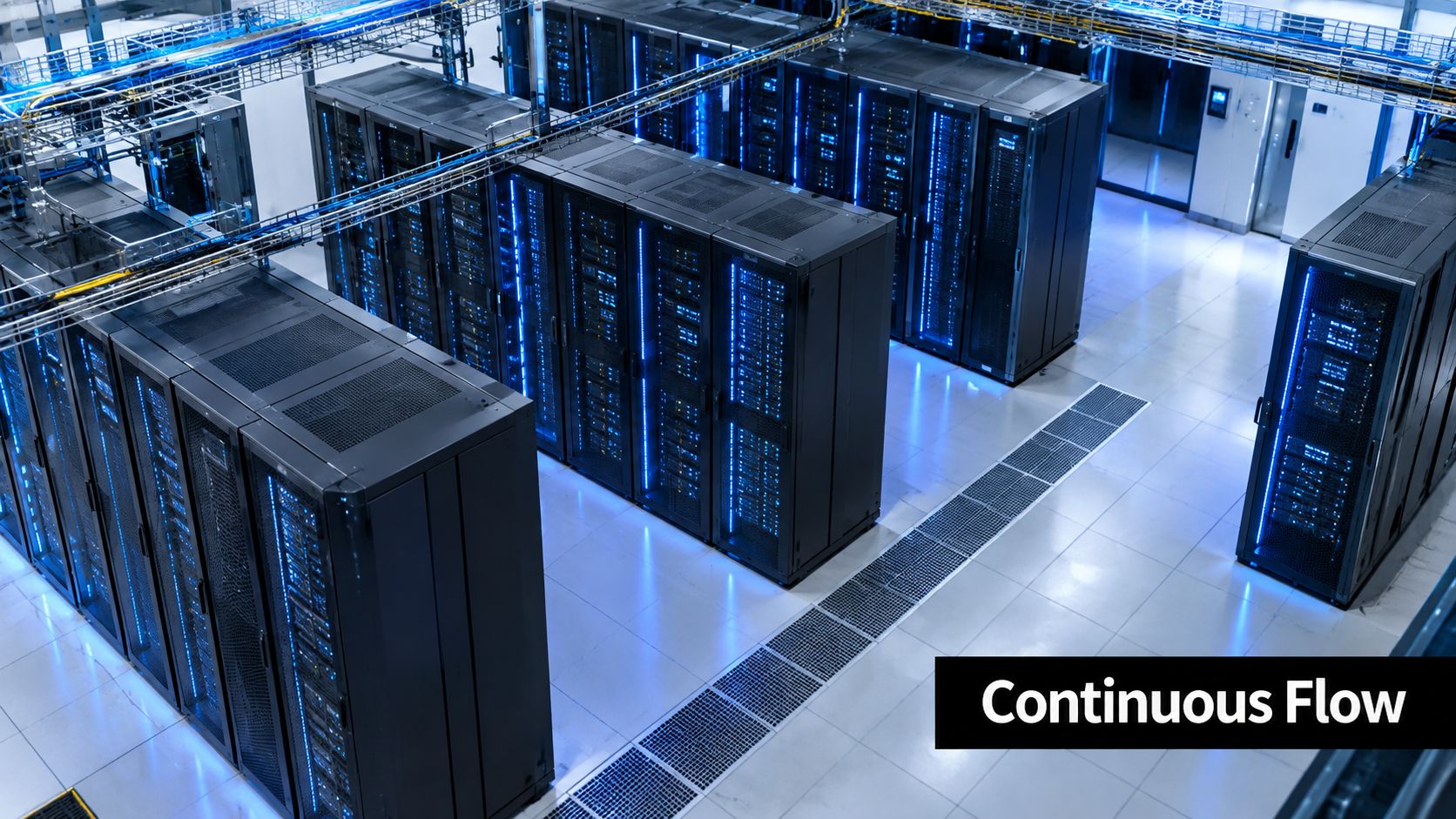 A modern data center room featuring rows of server racks illuminated by blue LED indicator lights.