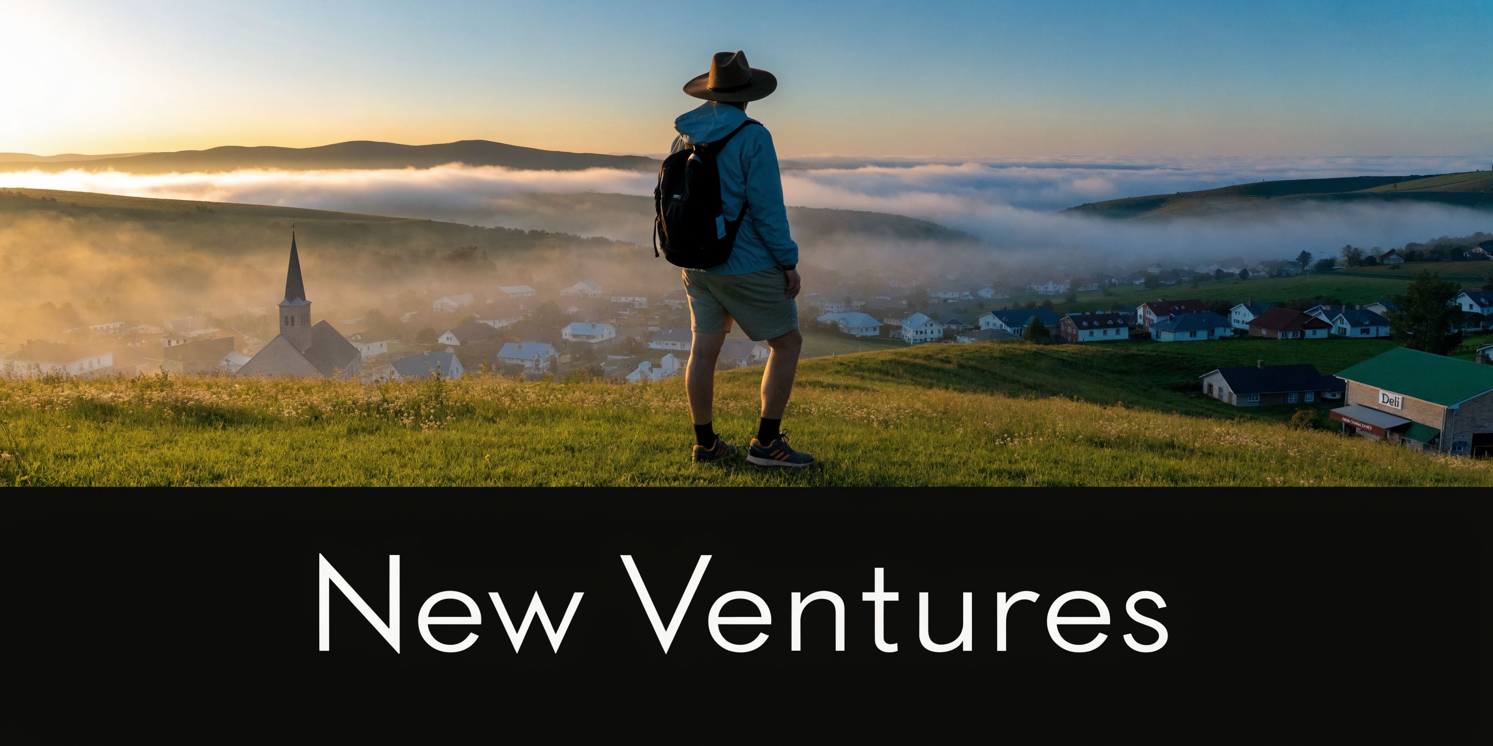 A traveler wearing a hat and backpack stands on a grassy hill overlooking a foggy village.