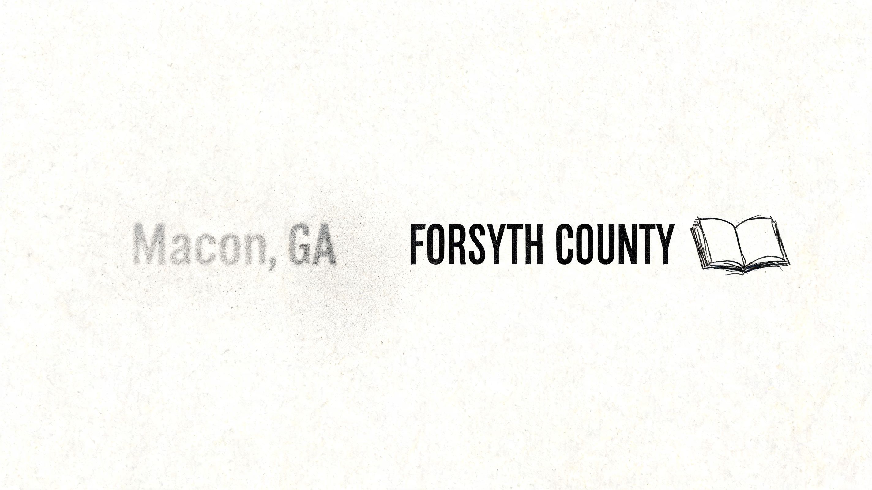 Text reading Macon, GA and Forsyth County next to a small line-art drawing of an open book.