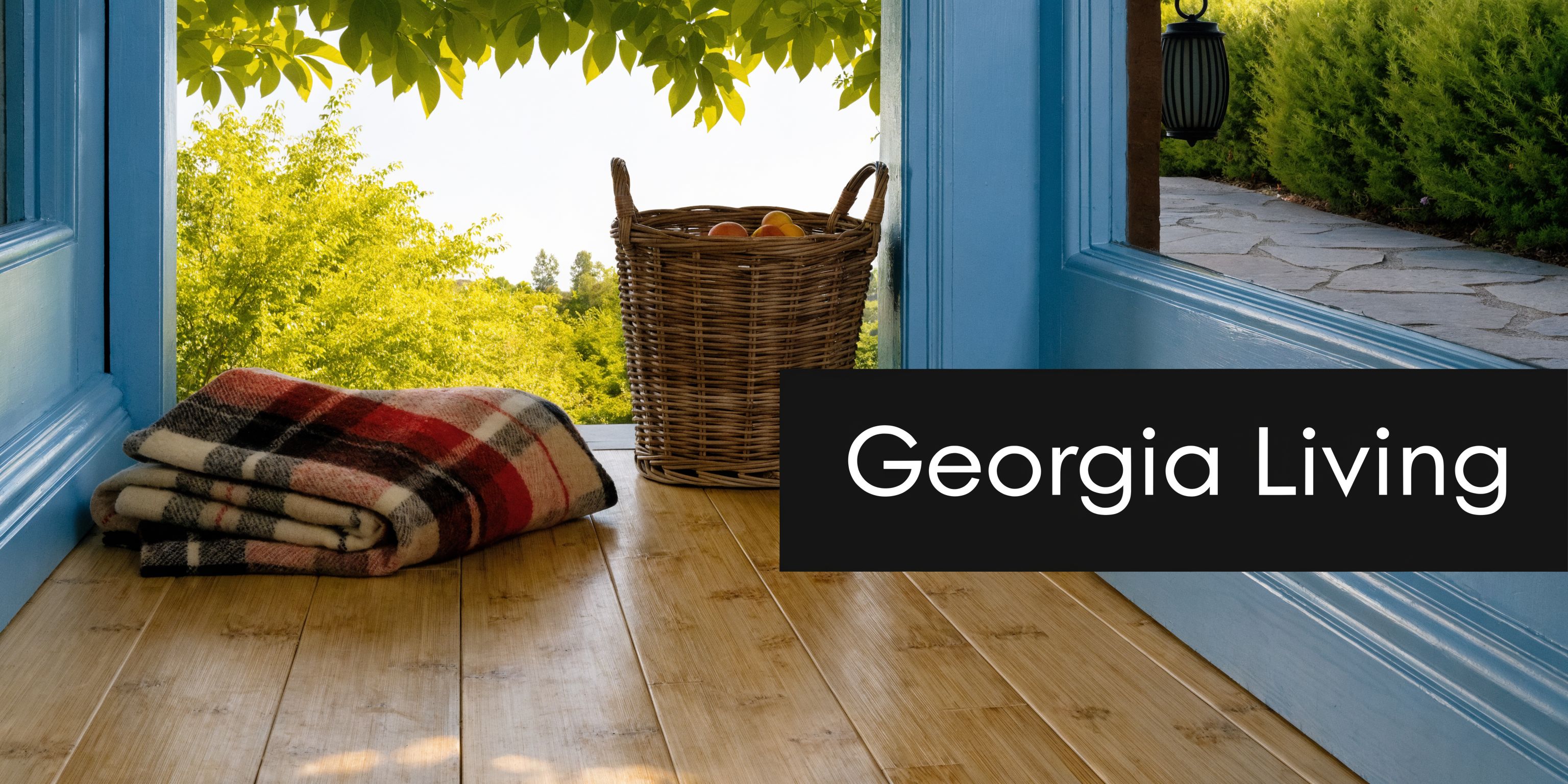 A cozy porch with eco forest bamboo flooring, a folded plaid blanket, and a wicker basket of peaches.