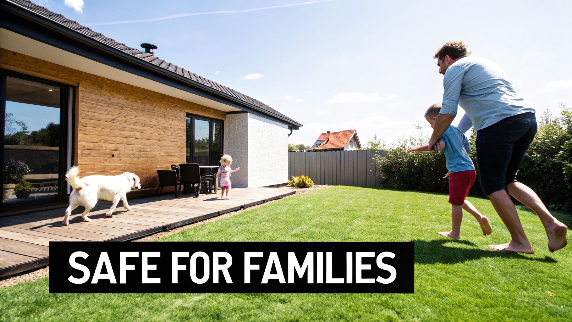 A family with children and a dog playing in the sunny backyard of a modern house.