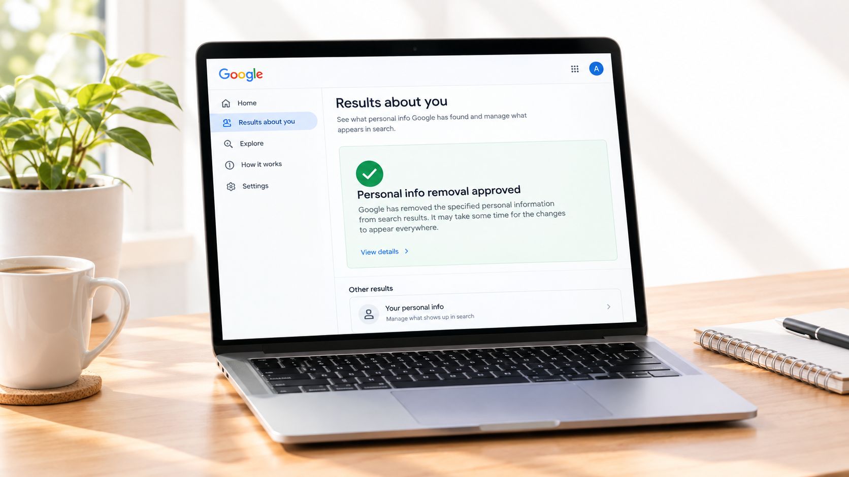 A laptop screen displaying the Google search Results about you page, showing a personal information removal approval.