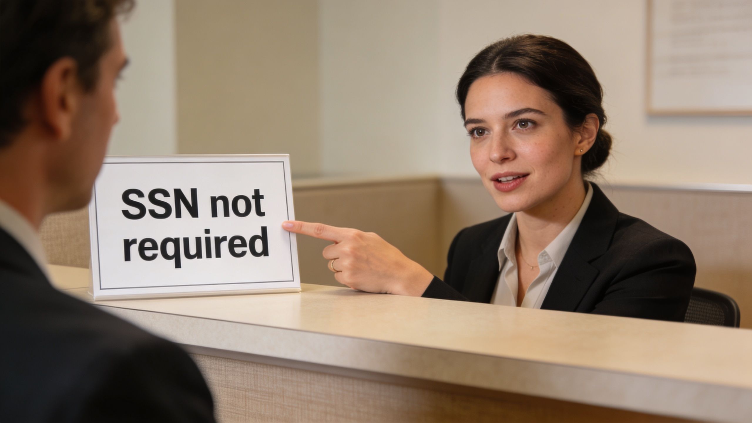 A professional woman at a reception desk pointing to a sign that reads SSN not required.