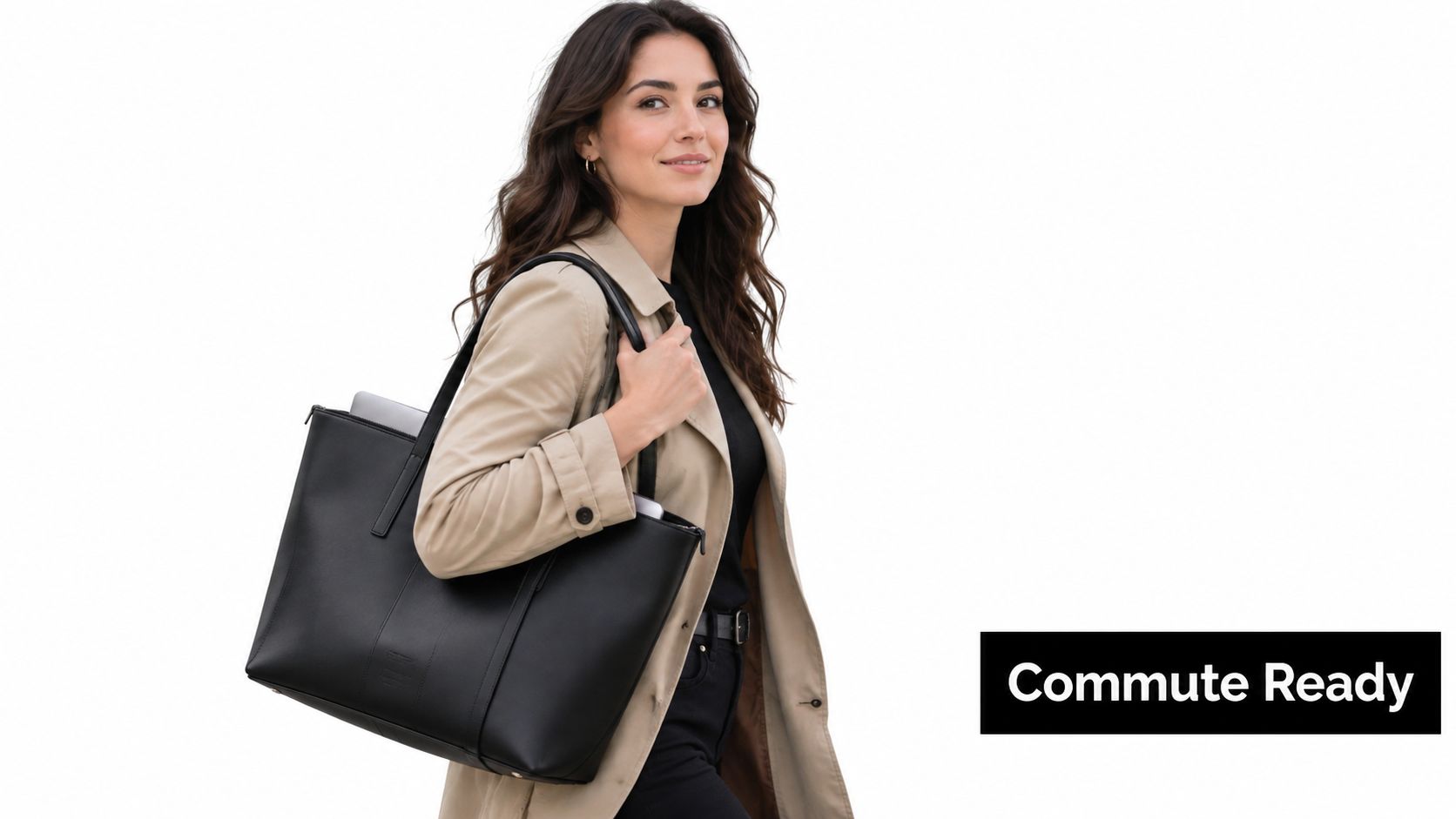 A professional woman wearing a beige trench coat carries a stylish black leather work tote bag.