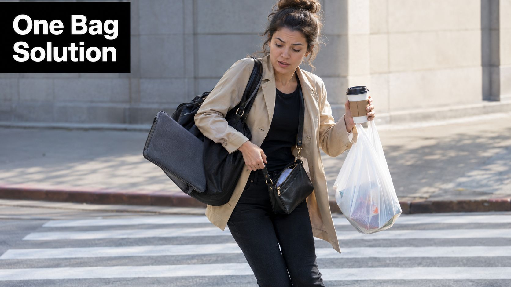 A woman carrying multiple bags and a coffee cup while crossing a street in the city.