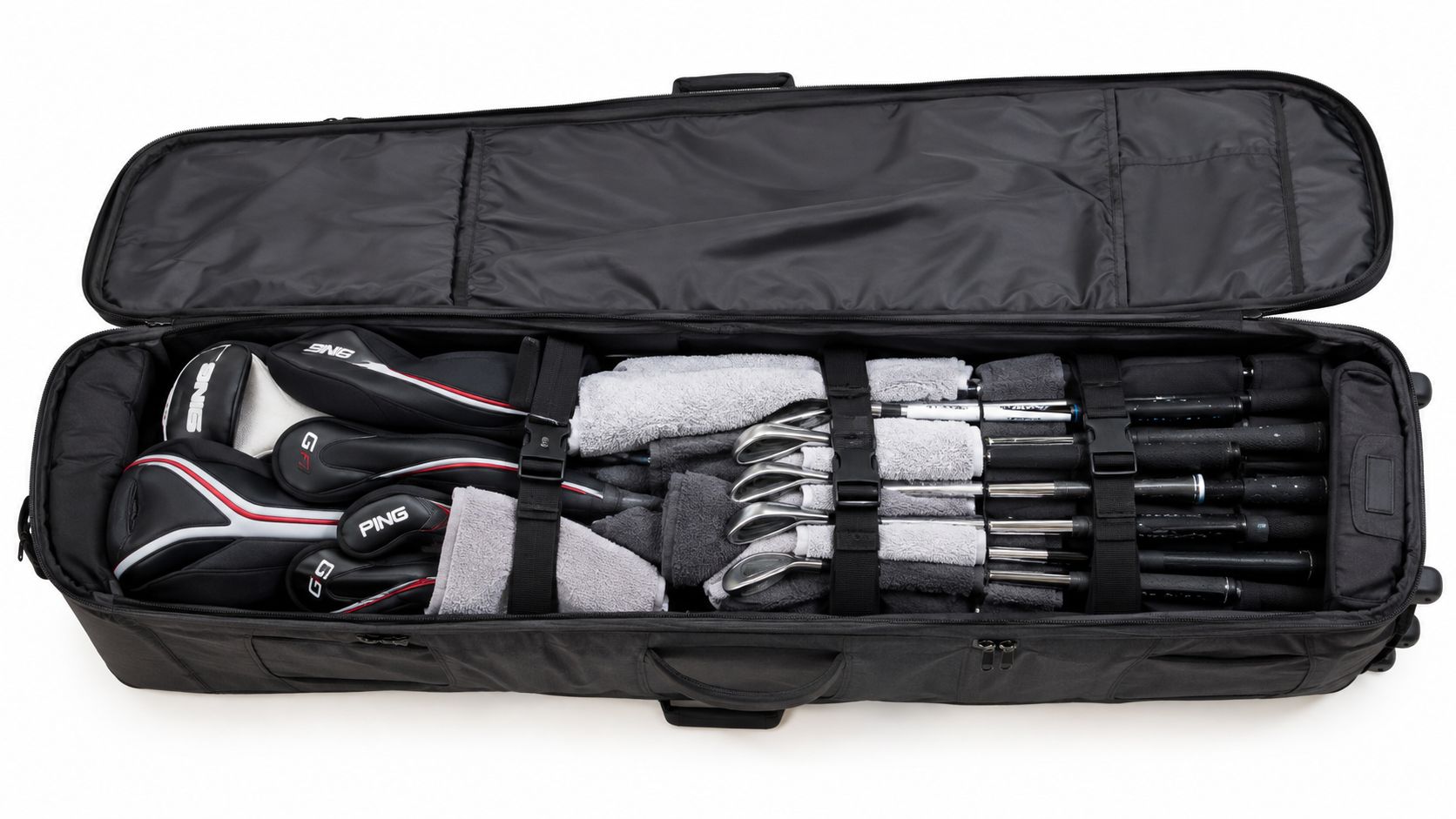 A black golf travel case lying open on a white surface with clubs and protective towels inside.