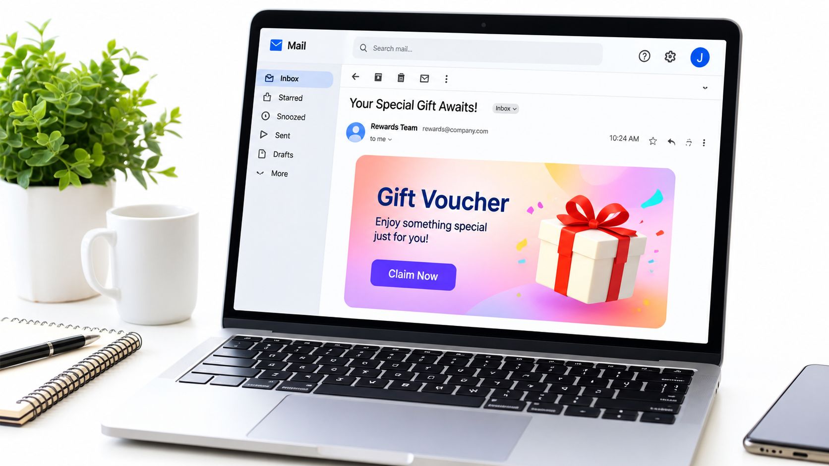 A laptop screen displaying a promotional email for a special gift voucher from a rewards team.